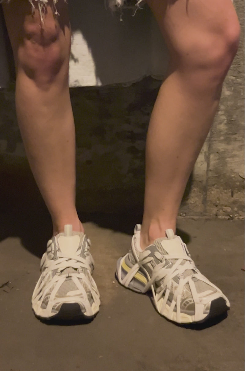 Video of person  wearing the AZALEA WANG SELIE WHITE FLAT SNEAKER, accented in gray and yellow. All angles of shoes are feature in this video. 