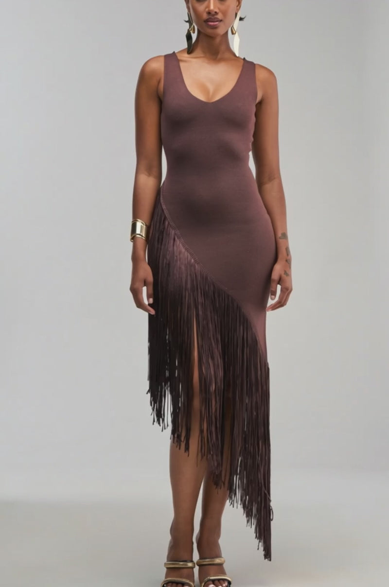 Video of a woman modeling the SHAKE IT FRINGE MIDI DRESS IN BROWN, featuring an asymmetrical silhouette and sleeveless design.