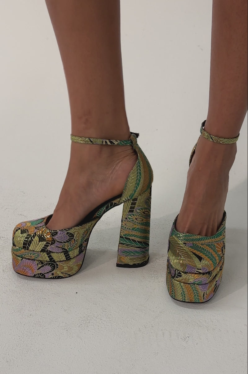 Video of woman modeling the AZALEA WANG ZIPPHORA GREEN MULTI BROCADE PLATFORM PUMPs with chunky block heels.