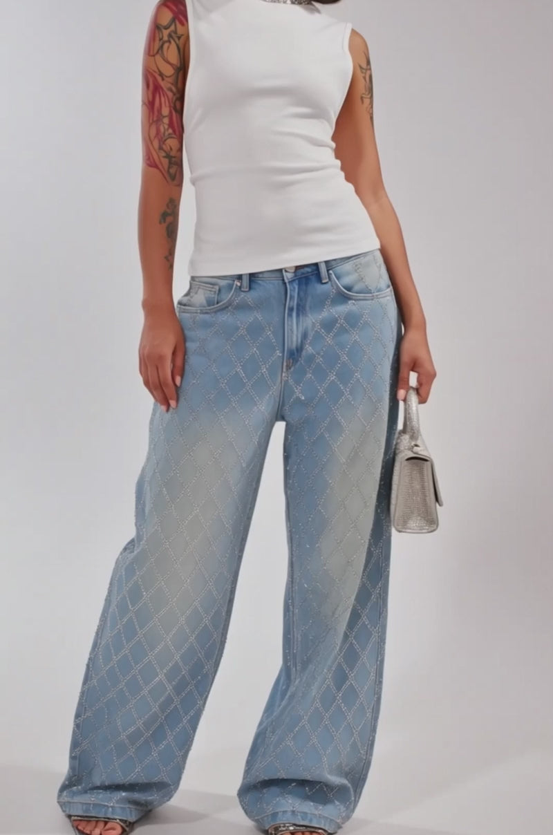 Video of woman modeling the SHINE BRIGHT RHINESTONE DENIM high-rise light blue jeans with a lattice rhinestone design