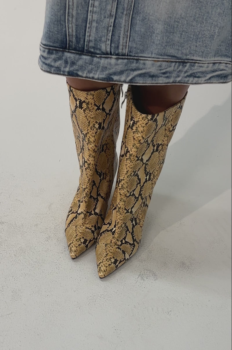 Video of woman modeling the AZALEA WANG VINCI Yellow Snake PU Print Wedge Bootie.