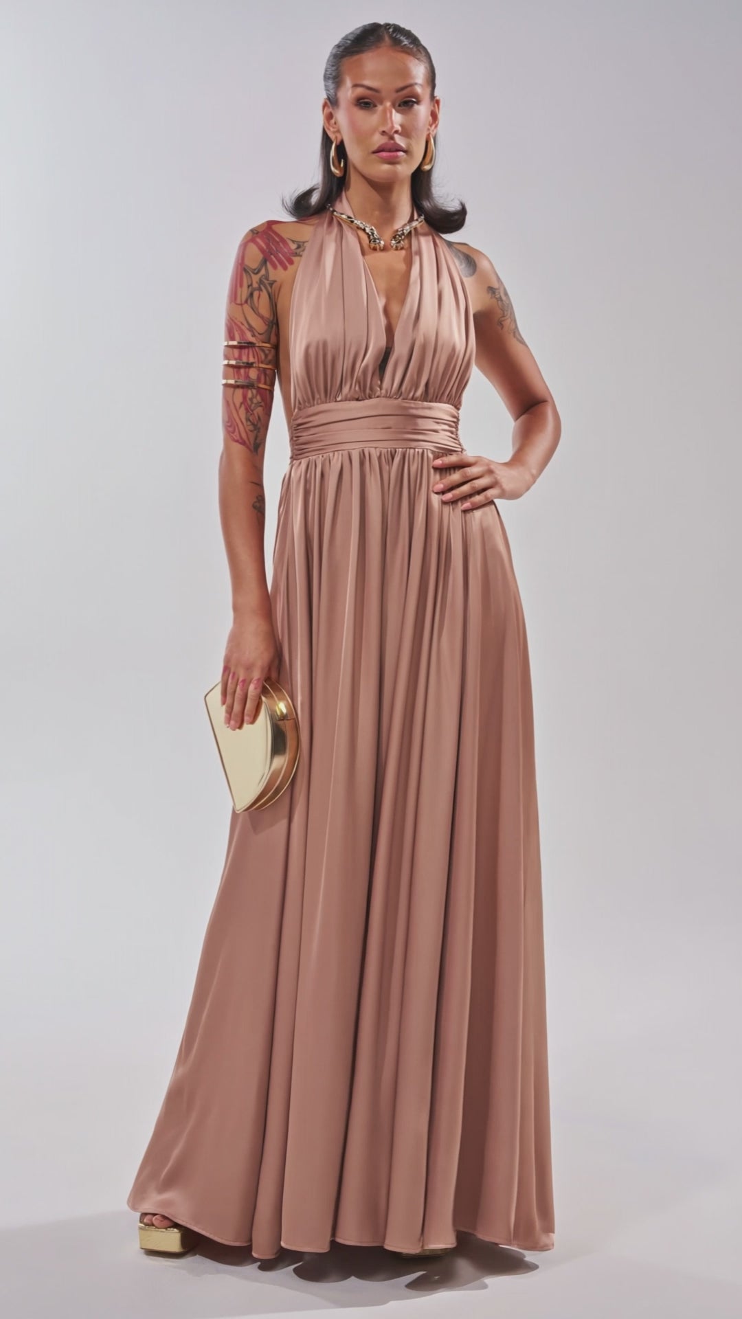 Video of woman modeling the BEST DRESSED SATIN JUMPSUIT in taupe