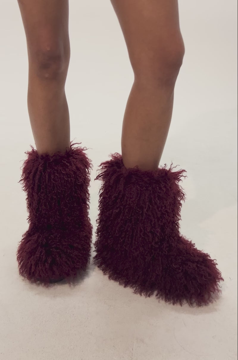Video of woman modeling the AZALEA WANG AZAD BURGUNDY FUR FLAT BOOTIE.