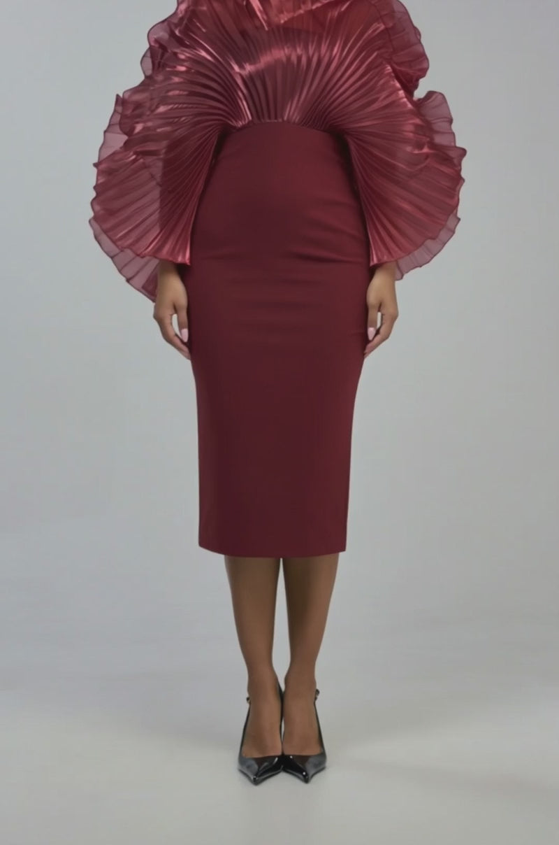 Video of a woman modeling the BY THE SEA SHORE Bandage Midi Dress in Burgundy, featuring a fitted silhouette and dramatic pleated organza ruffles defining the shoulders and sleeves.