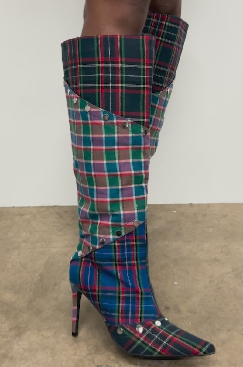 Video of woman modeling the AZALEA WANG FENMORE PLAID MULTI COLOR BLOCKED STILETTO BOOT against a plain white background.