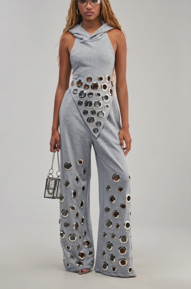 Video of a woman modeling the CHECK IT OUT GROMMET TOP.