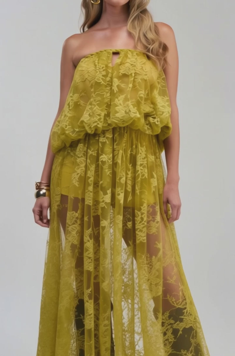 Video of a woman modeling the HANNAH LACE BLOUSE, a strapless yellow lace top with layered, sheer chartreuse fabric. 