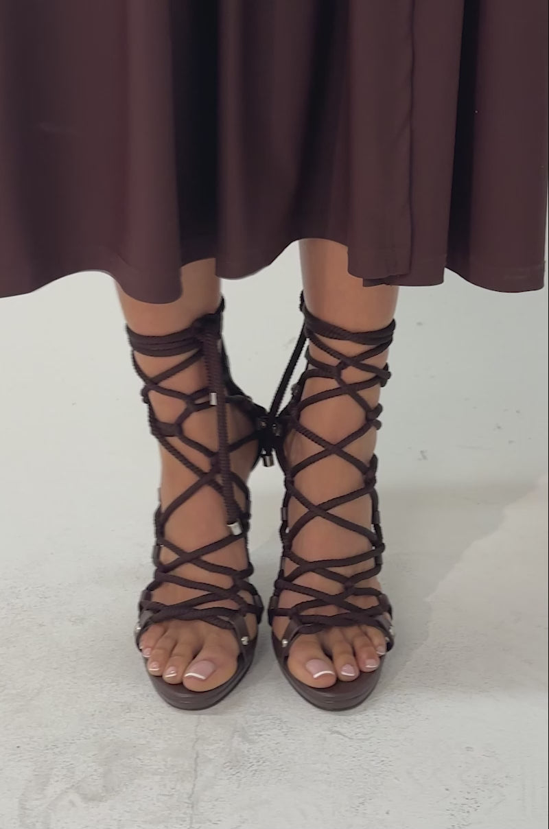 A video of a woman wearing the AZALEA WANG BROWN PU ROPE STRAP STILETTO SANDAL.