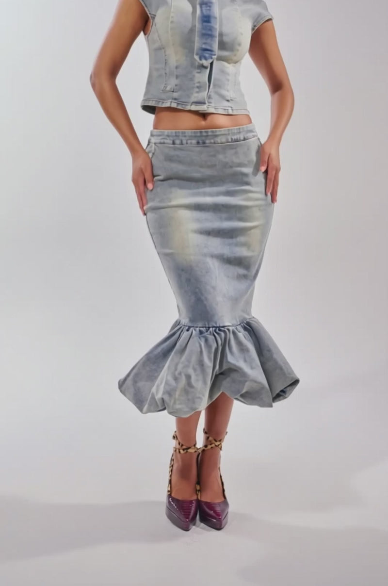 Video of woman modeling the JOSIE DENIM MIDI SKIRT with a matching cropped denim button-up top and ankle-strap heels against a plain background.