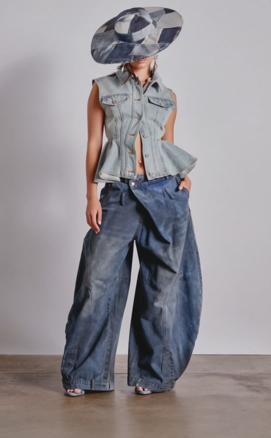 A video of a model wearing the FORGET ABOUT YOU PEPLUM DENIM VEST and wide-leg baggy jeans.