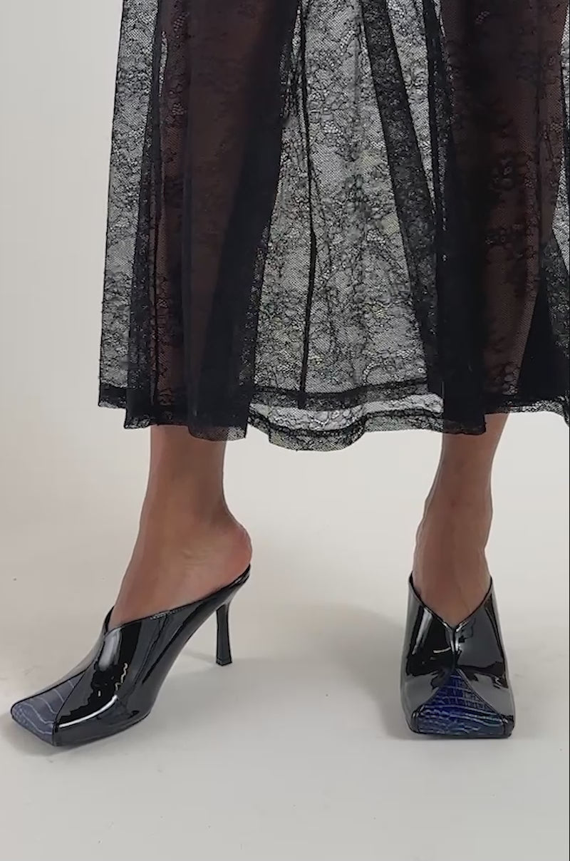 Video of a woman modeling the AZALEA WANG OBSESS NAVY AND BLACK COLORBLOCKED STILETTO PUMP.