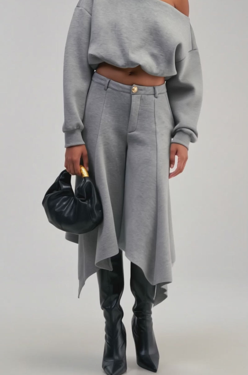 Video of a woman modeling the WILD AND FREE OFF THE SHOULDER TOP—a grey, cropped sweatshirt that’s a modern streetwear essential.