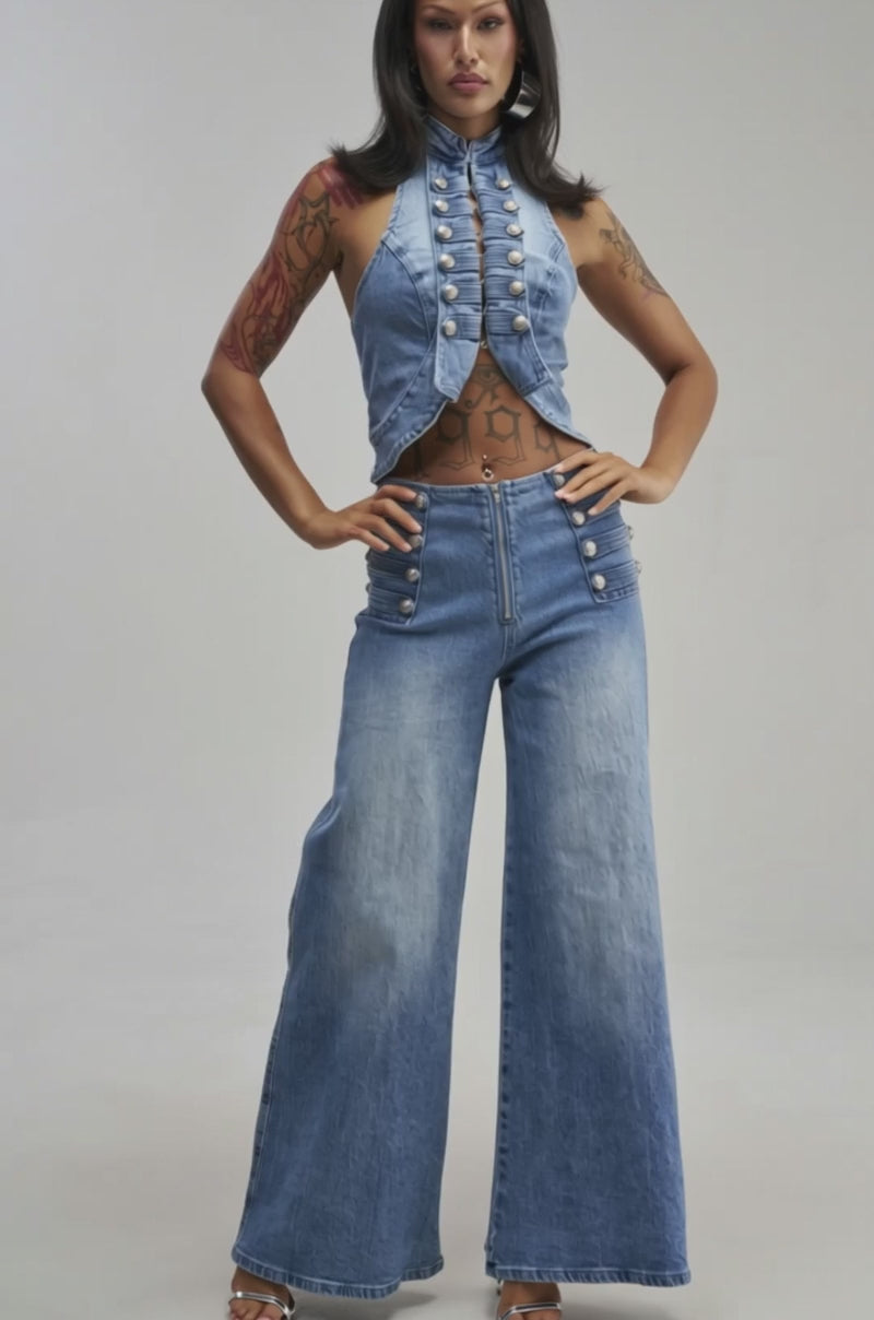 Video of a woman modeling the ALIGNED MILITARY DENIM TOP, a sleeveless, buttoned halter piece.