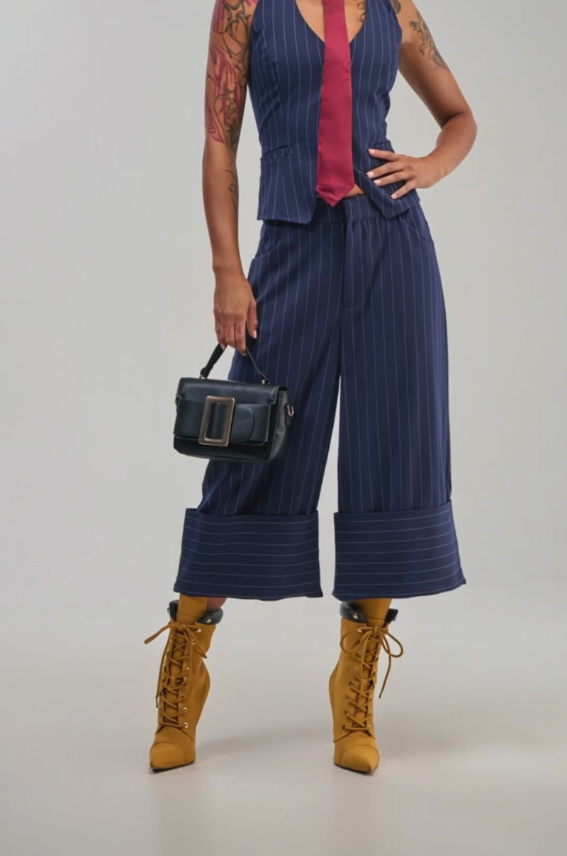 Video of a woman modeling the BIG BANK STRIPED GAUCHO in navy pinstripe.