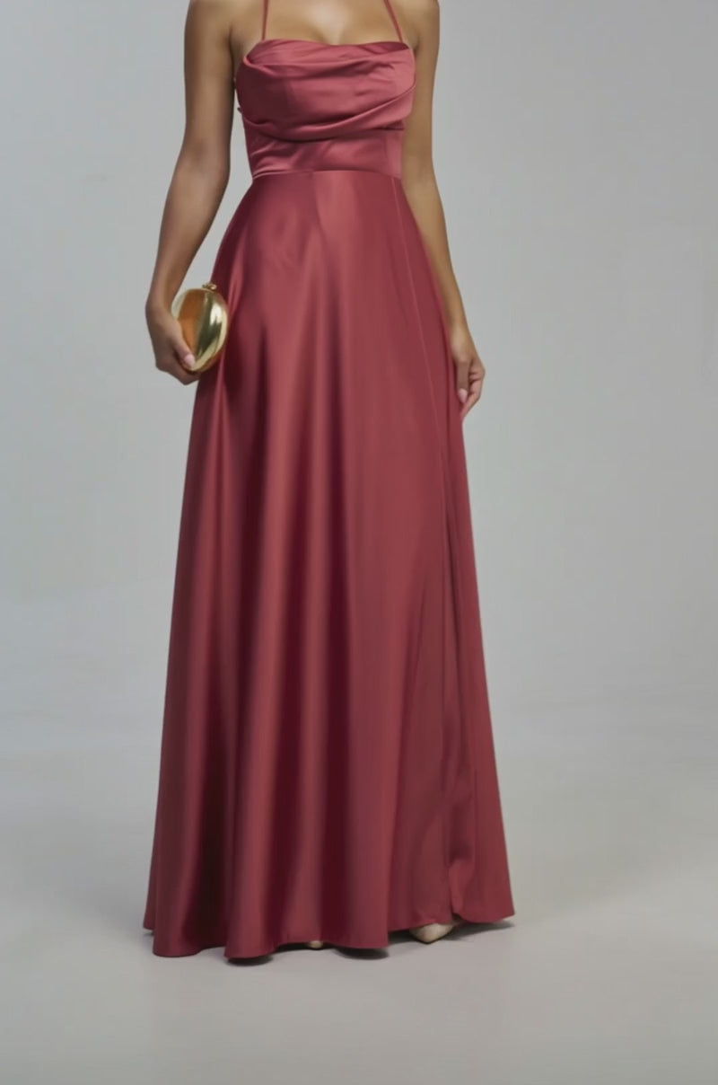 Video of a woman modeling the HOT GIRL PENDING SATIN MAXI DRESS IN MARSALA—a sleeveless satin maxi featuring a thigh-high slit.