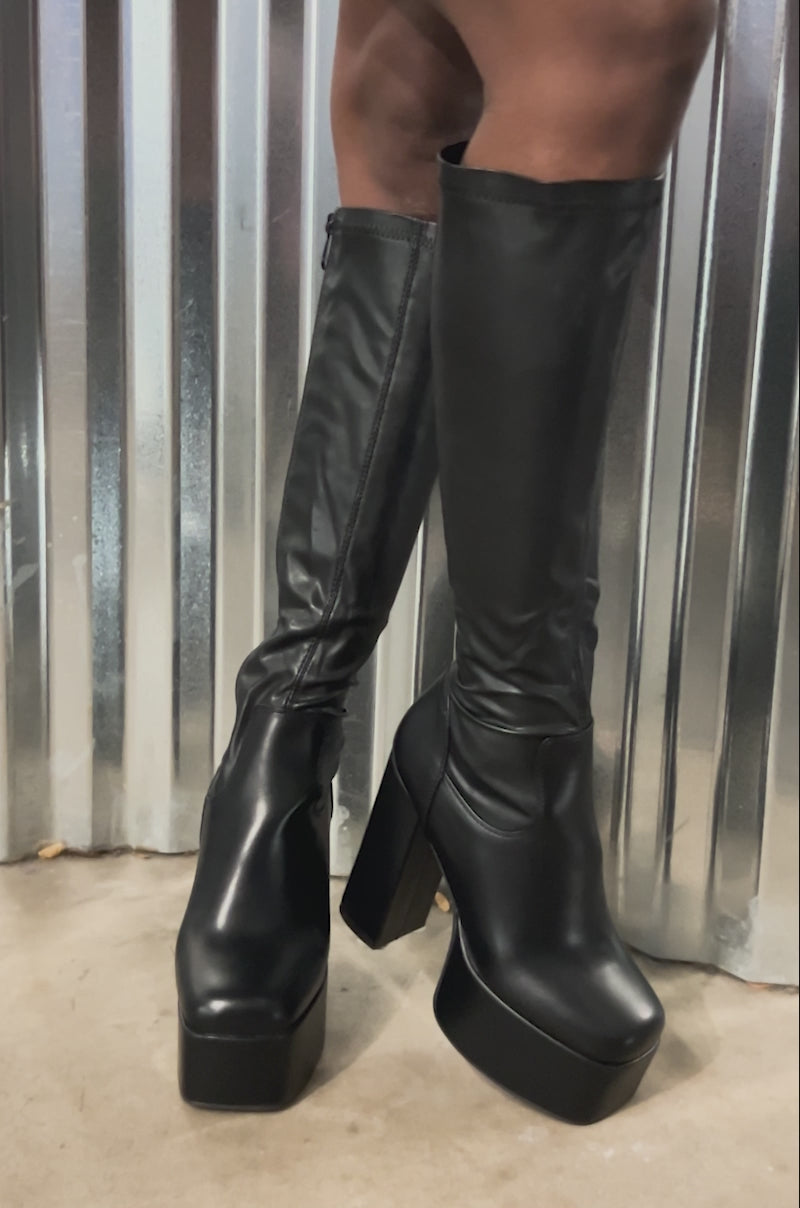 Video of woman modeling the AZALEA WANG BOMBON BLACK STRETCH PU CHUNKY BOOT 