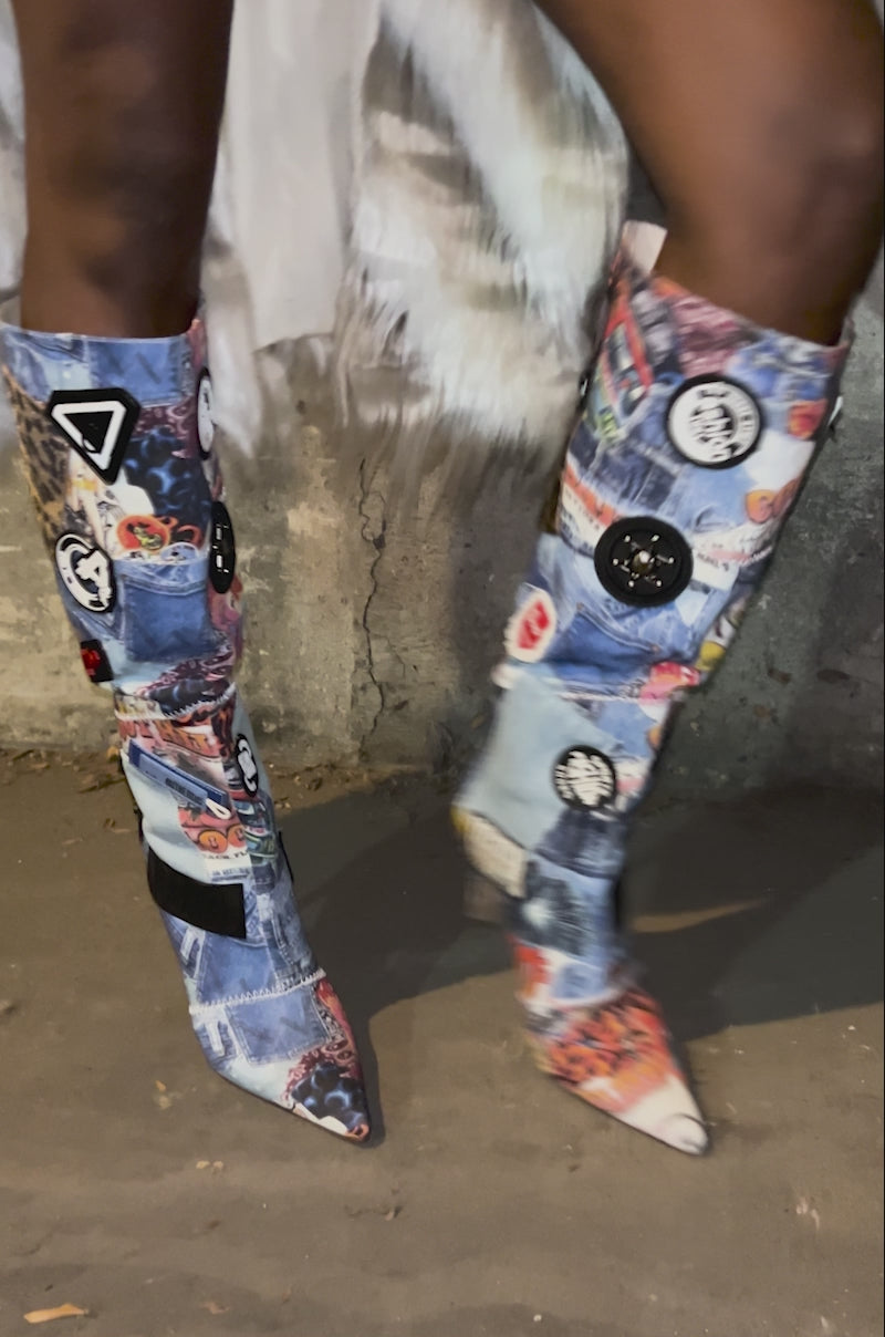 Video of woman modeling the AZALEA WANG SYLRILA MULTI ABSTRACT BOOT, featuring colorful denim patches, animal print, and badges in an abstract design