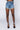 Front View Runway High Waisted Stretchy Rhinestone Jean Shorts in Medium Blue Denim