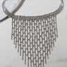 Experience the SAY YOU LOVE SOMEONE NECKLACE SILVER by H&D Accessories, featuring a silver chain with a secure clasp, embellished with multiple rows of small, sparkling rhinestones. This exquisite necklace showcases an intricate, cascading fringe design with long, dangling strands arranged in a descending V-shaped pattern. Displayed against a white surface for maximum elegance.