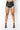 Front View Shake A Tail Feather Rhinestone Fringe Shorts in Black