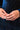 A close-up of a person's hands adorned with multiple RM Manufacturing RING SILVER pieces on one finger, featuring white nail polish. The person is dressed in a blue velvet dress with gold vertical stripes.