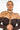 A person with braided hair is wearing an off-the-shoulder black top and THE BEST IS YET TO COME BODY CHAIN draped over their shoulders. The background is plain and bright, emphasizing the detailed design of the body chain. The person gazes confidently at the camera.
