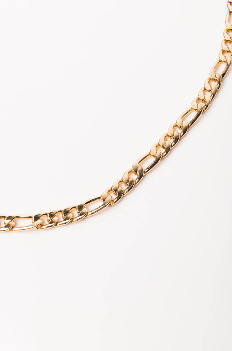 A close-up image of THE STREETS BELLY CHAIN against a white background. The chain features a series of interlocking flat links, providing a sleek and elegant appearance.