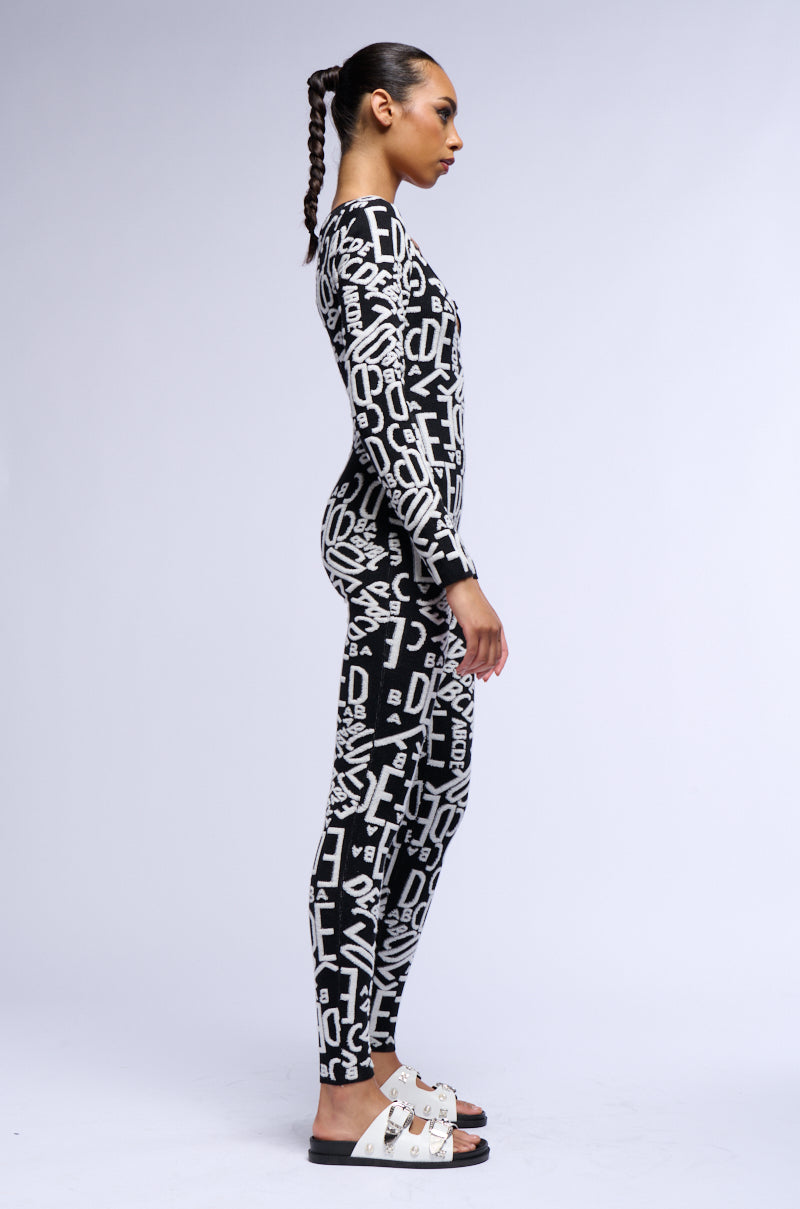 Detail View Turning Heads Knit Long Sleeve Jumpsuit In Black