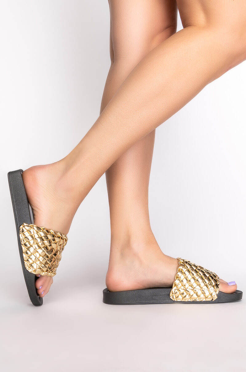 Side View Twisted Love Flat Sandal In Gold 3