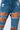 Detail View Unstressed Distressed Skinny Jeans in Medium Denim