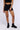 Front View Yoga Cross Front Ruched Biker Short In Black