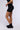 Side View Yoga Cross Front Ruched Biker Short In Black