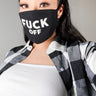 A person wearing a YOU KNOW WHAT TO DO FASHION FACE COVER, which has the words "FUCK OFF" in bold white letters. They have long dark hair, visible eyeliner, and are dressed in a black and white checkered shirt over a white top. The background is neutral.