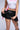 Extra View Yours Truly Faux Leather Micro Mini Skort In Black